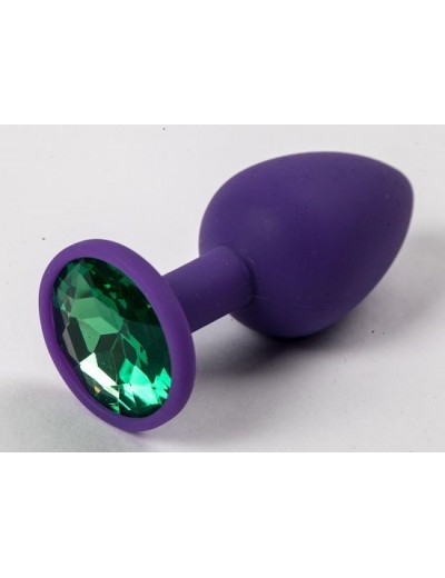 Фиолетовая силиконовая анальная пробка с зеленым стразом - 7,1 см.