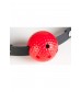 Красный пластиковый кляп-шар на чёрных кожаных ремешках